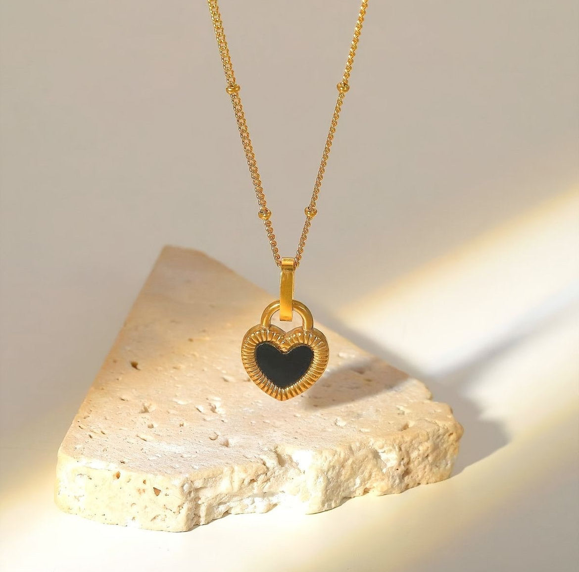 Reversible heart necklace
